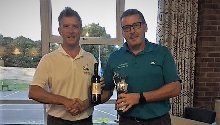 Chris Faulkner receiving the new silverware after winning the Autumn Masters with a superb 41 points.